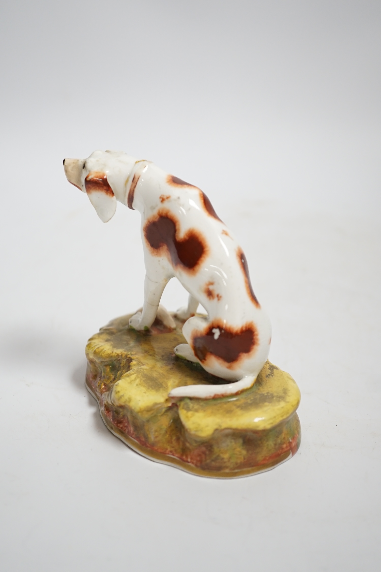 A rare Staffordshire porcelain model of a pointer, c.1830-50, 10cm high